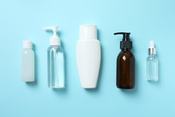 Natural cosmetic products a blue background, top view