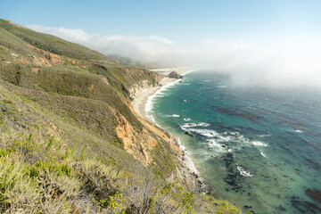 Scenic coastal view of rugged cliffs meeting the Pacific Ocean