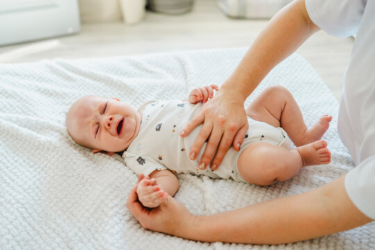 Gentle Touch, Caring for a Crying Baby on Soft Bedding