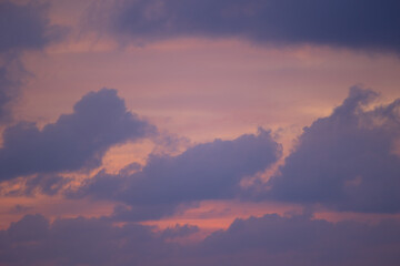 Vibrant sunset over thailand: purple and pink sky with dramatic clouds