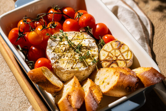 Baked Camembert with Cherry Tomato, Garlic, and Bread Slices