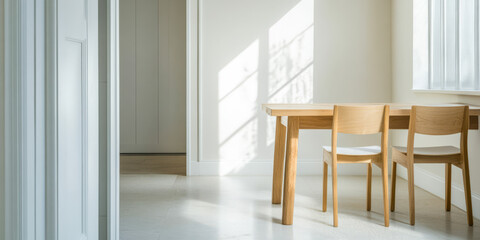 Fototapeta premium Bright and airy modern dining area with wooden furniture in a minimalist setting
