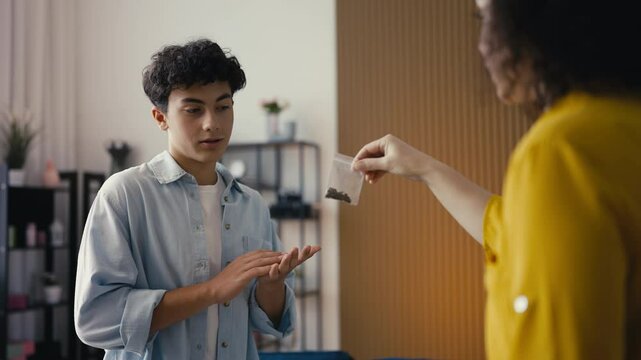 Angry mom scolding her adolescent son for smoking marijuana, bad influence