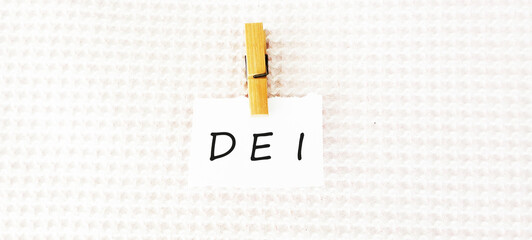 DEI diversity equality inclusion symbol. Concept words DEI diversity equality inclusion on blocks...