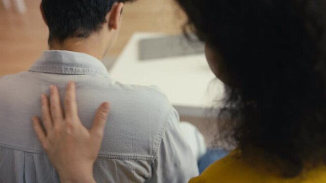 Mother comforting and supporting her depressed adolescent son, family strength