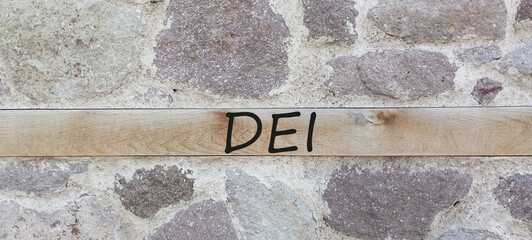 DEI diversity equality inclusion symbol. Concept words DEI diversity equality inclusion on blocks...