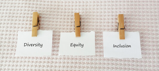 DEI diversity equality inclusion symbol. Concept words DEI diversity equality inclusion on blocks...