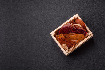 Jerky, dried meat in the form of slices with salt, spices and herbs