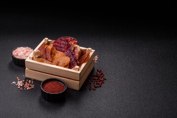 Jerky, dried meat in the form of slices with salt, spices and herbs