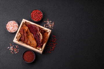 Jerky, dried meat in the form of slices with salt, spices and herbs