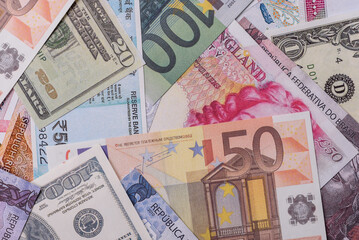 A background consisting of paper banknotes of different currencies