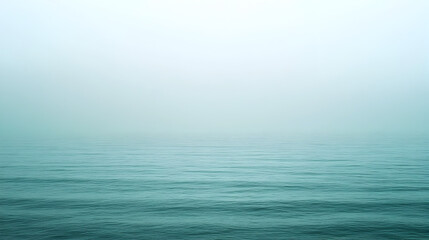 Obraz premium Serene expanse of the ocean meeting the sky in the hazy horizon