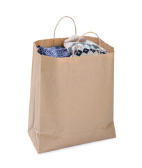 Used clothes in paper bag isolated on white