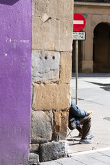 Beggar asking for alms in the Old Town of Pamplona