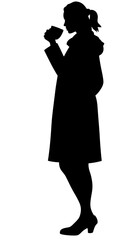 Contemplative woman drinking tea in cozy fall silhouette, inner warmth