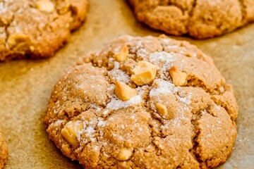 Golden Cookie Delight: A close-up shot of delicious, freshly baked golden cookies, showing the...