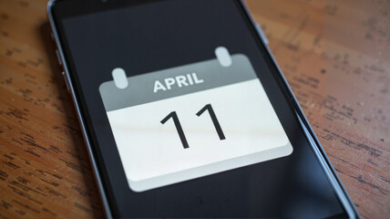 Digital calendar reminder for April 11 on a phone, awareness