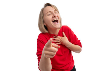A cheerful woman in a red sweater laughing and pointing at the camera against a white background.