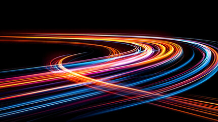 Abstract Light Trails Creating Curved Patterns With Colorful Streams Against a Black Background