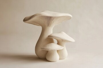 Four decorative mushrooms are displayed against a plain background