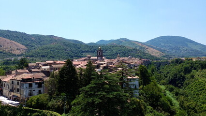 Aerial view of Sant'Agata dei Goti city in South Italy surrounded of Mountains and gree vegetation on Summer light