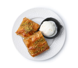 Delicious baklava with crushed nuts and ice cream isolated on white, top view