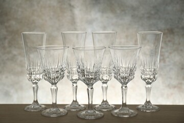 Many empty clean glasses on wooden table
