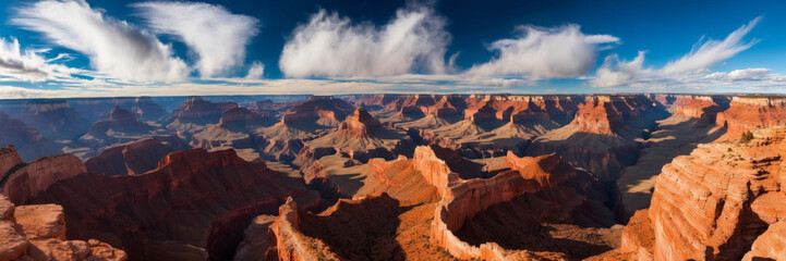 Vast panorama of the Grand Canyon with dynamic cloud formations over the iconic landscape.