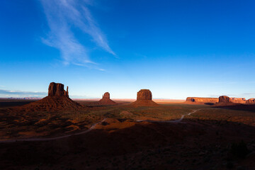 Afternoon light on sandstone buttes in the desert of Monument Valley, in Arizona and Utah.