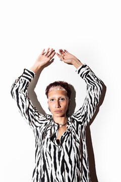 Fashion Model in Zebra Print Shirt Under Studio Lighting