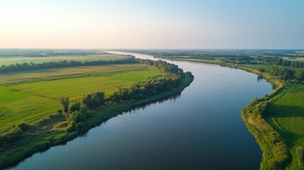 Obraz premium Scenic river view lush farmland aerial photography tranquil environment serene landscape concept
