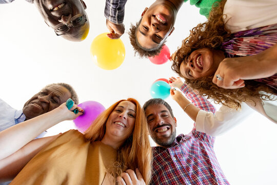 Group Celebrating with Balloons in a Joyful Birthday Gathering