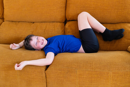 Young boy at home smiling as he loses his milk teeth