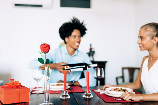 Romantic dinner setup with couple dining and candlelight
