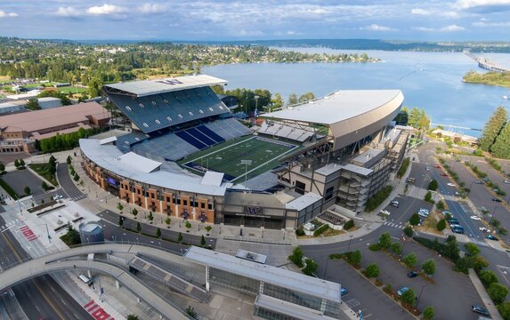 Aerial view of Alaska Airlines Field, home of the Washington Huskies football team. Spacious stadium and surrounding parking lots. University Of Washington, Seattle, Washington, USA. 17 July 2024