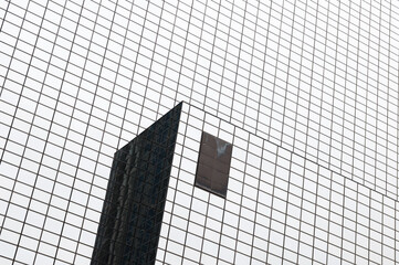 Modern office building in low angle view. Corporate futuristic glass facade building