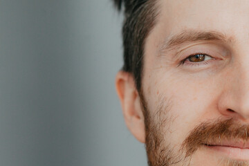 Close-up of the face of a handsome young man with brown eyes