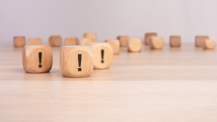 three wooden cube with exclamation marks, symbolizing urgency, warning, or important information