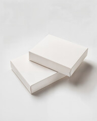 Simple white boxes stacked on clean surface, suitable for storage or gift-giving in a minimalist setting