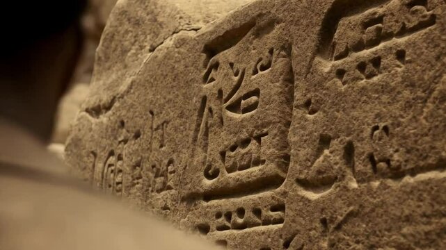 Exploring Ancient Carvings and Inscriptions on Stone Walls in a Historical Site During the Day