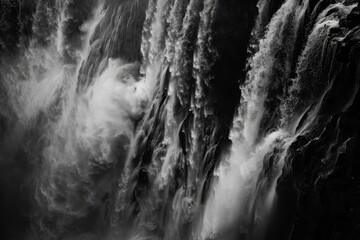 A breathtaking view of Iguazu Falls, featuring layers of cascading water creating a mesmerizing spectacle, Layers of cascading water creating a mesmerizing pattern at a waterfall junction