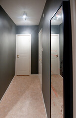 Hallway in an apartment painted grey.