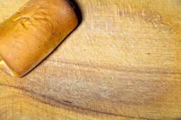 Freshly baked bread resting on a wooden cutting board