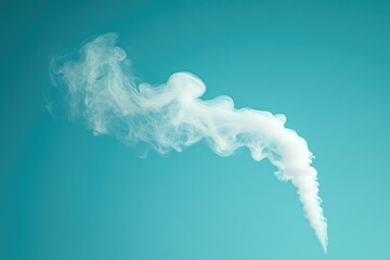 Naklejka premium White smoke billows against a vibrant teal backdrop, creating an abstract, ethereal scene.
