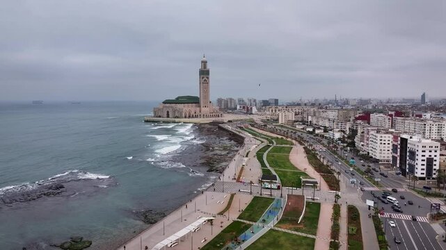 4K Aerial Zoom-In Over cloudy Casablanca, Morocco - Hassan II Mosque and Scenic Coastline