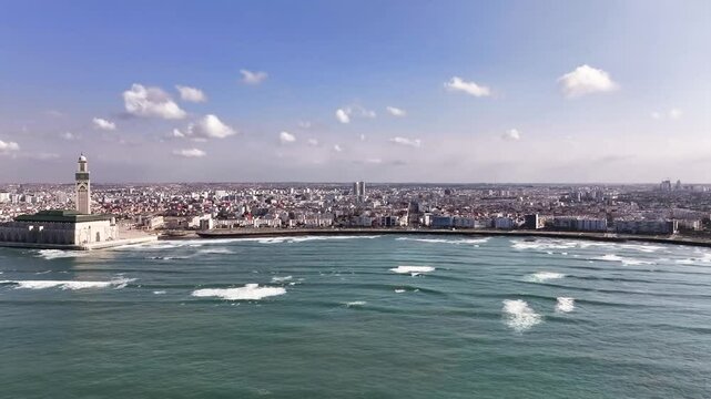 4k Aerial Zoom-In Over Casablanca, Morocco - Iconic Hassan II Mosque and twin center - Wide city view