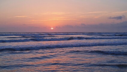 Sunset waves beach shoreline nature scene tranquil ocean scenic view