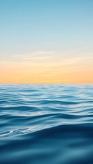 Fototapeta premium The tranquil ocean displays a colorful horizon and wavy water surface
