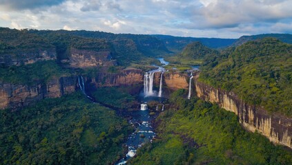 Naklejka premium Majestic waterfall cascade iguazu falls aerial view lush jungle nature