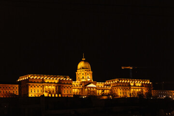 Buda Castle glowing at night in Budapest, Hungary